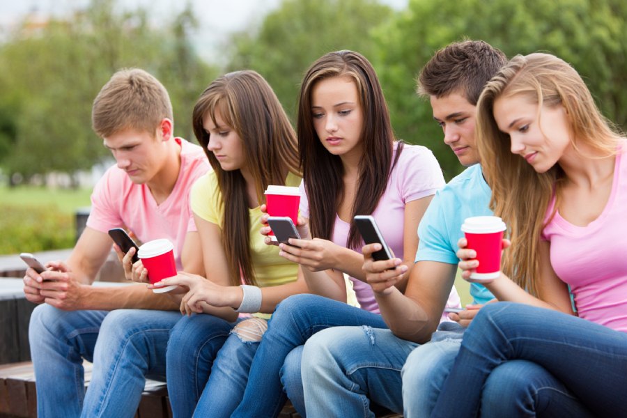 teenager playing with smartphone